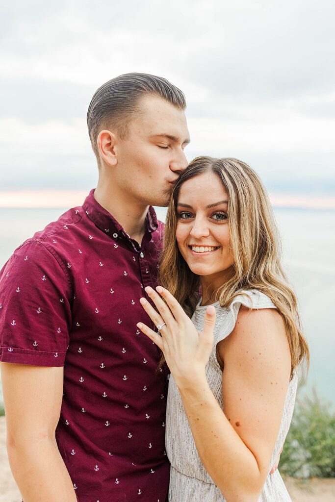 Emotional proposal moment at Pyramid Point Michigan