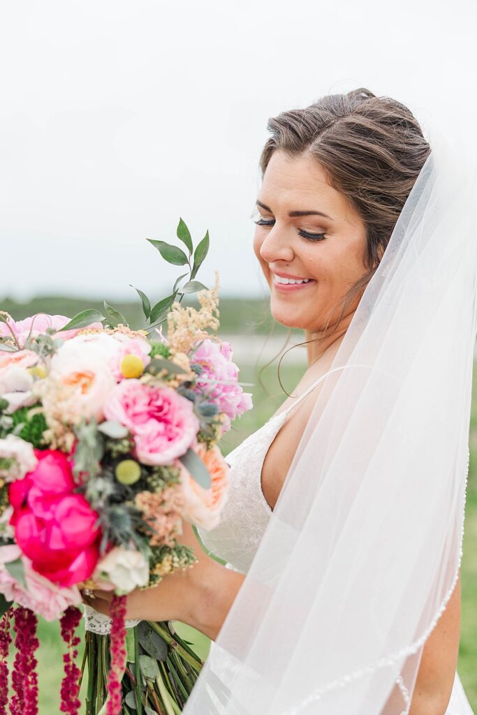 Elegant bridal portrait with colorful bouquet and soft natural light