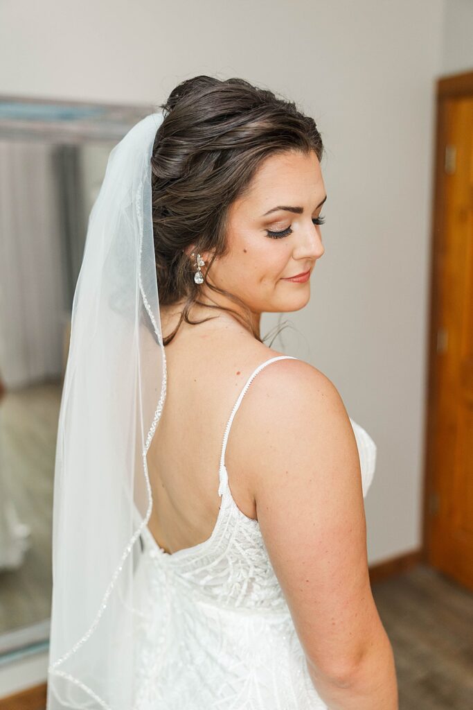 Bride’s final touches before heading to her Catholic wedding ceremony on Old Mission Peninsula