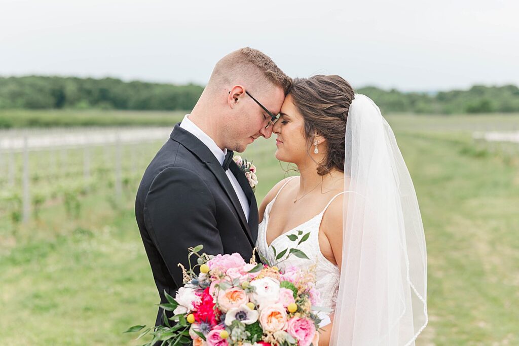 Bride and groom wrapped in a quiet, emotional moment during wedding portraits