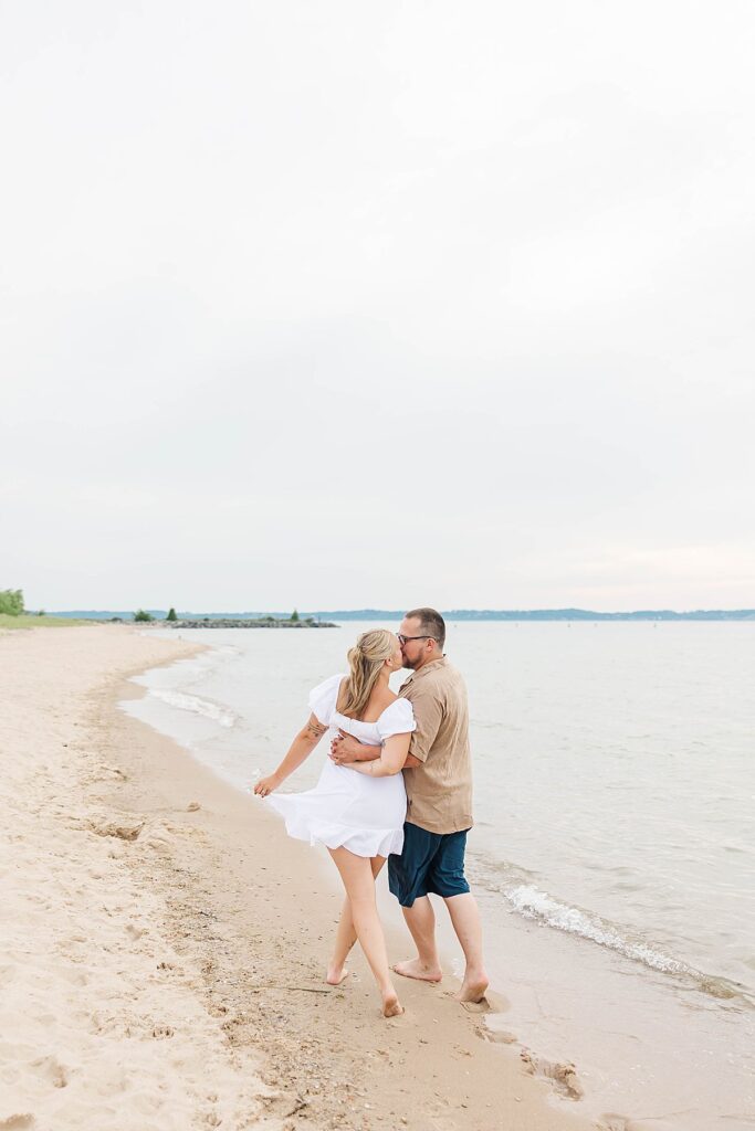 Fun engagement photos in the water at Dam Beach in Northern Michigan
