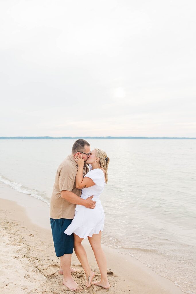 Engagement photos in Elk Rapids with soft light and Lake Michigan views