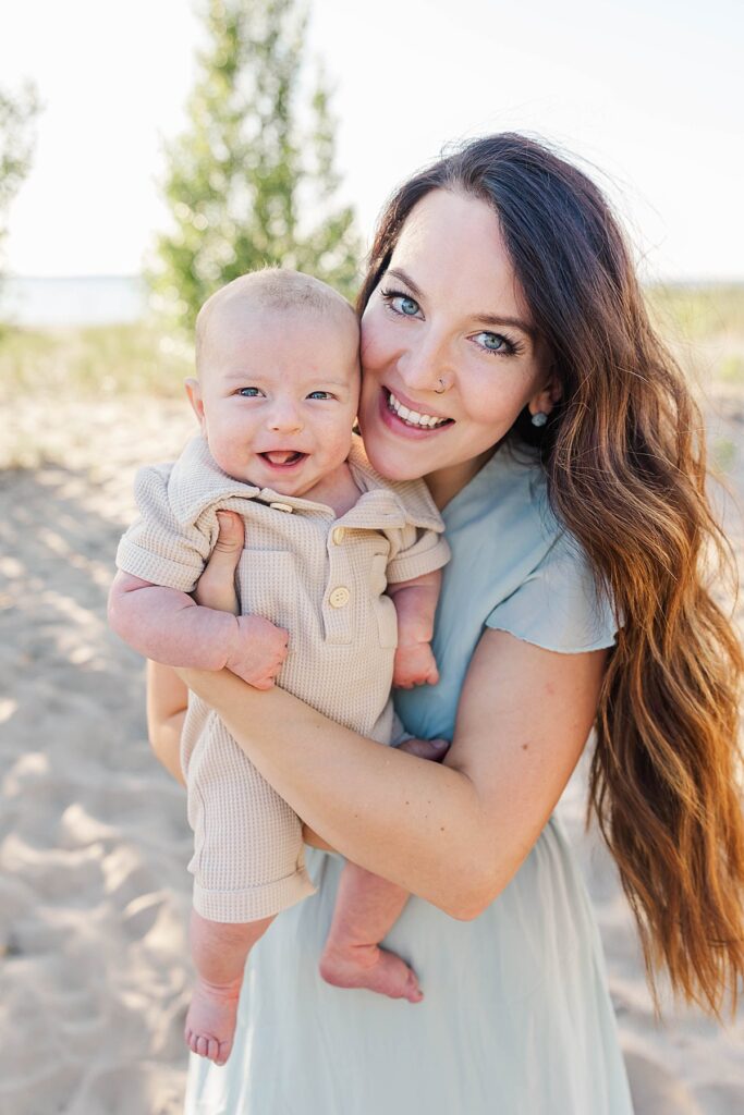 Mother holding her newborn during a Northern Michigan family session