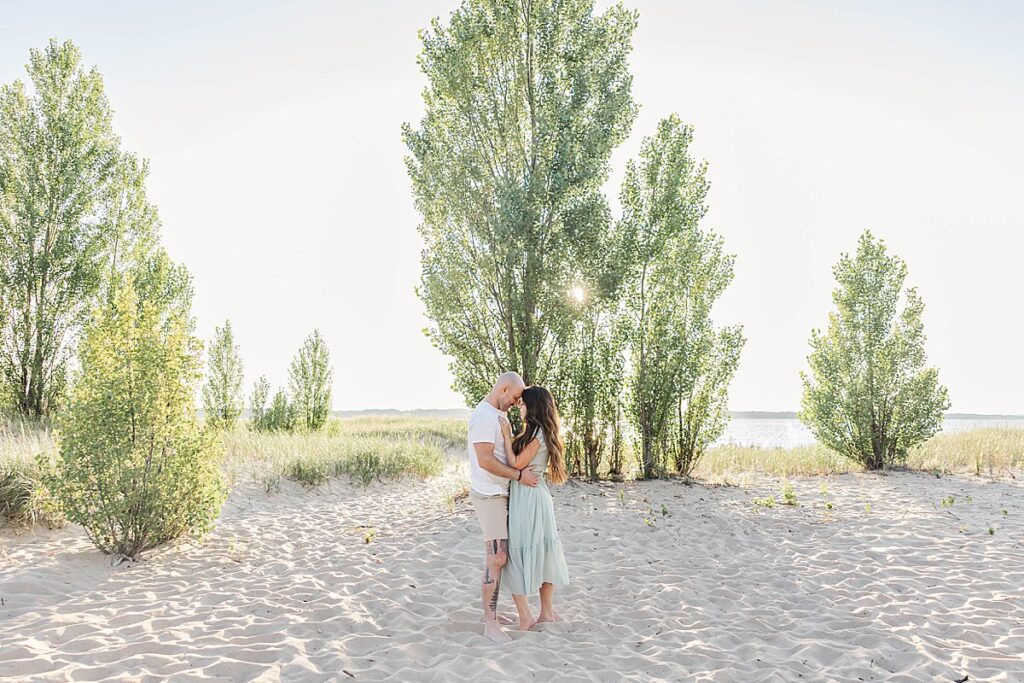 Parents sharing a quiet moment during their Elk Rapids family session