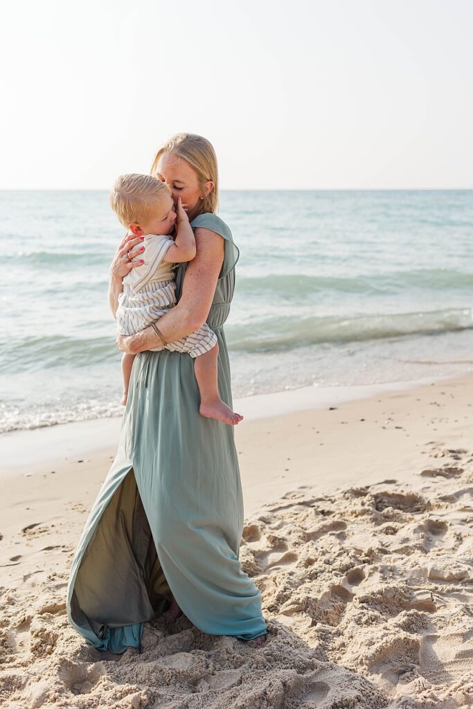 Mother and child sharing a quiet moment at Empire Beach