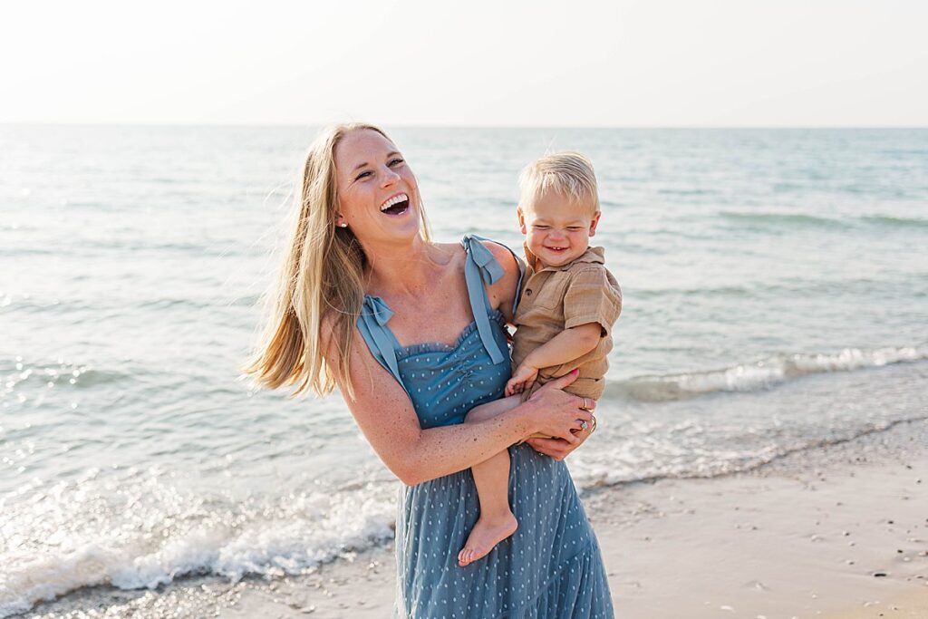 Mom holding her child during an Empire Beach family session