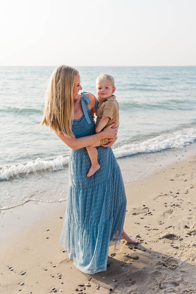 Mom holding her child during an Empire Beach family session