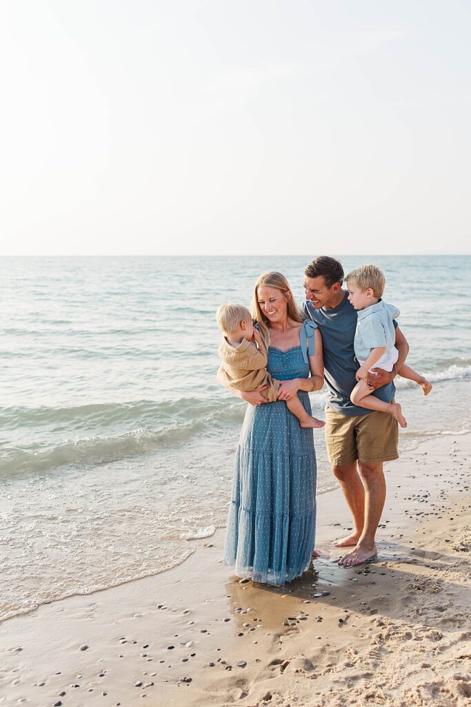 Candid family moments in the water at Empire Beach