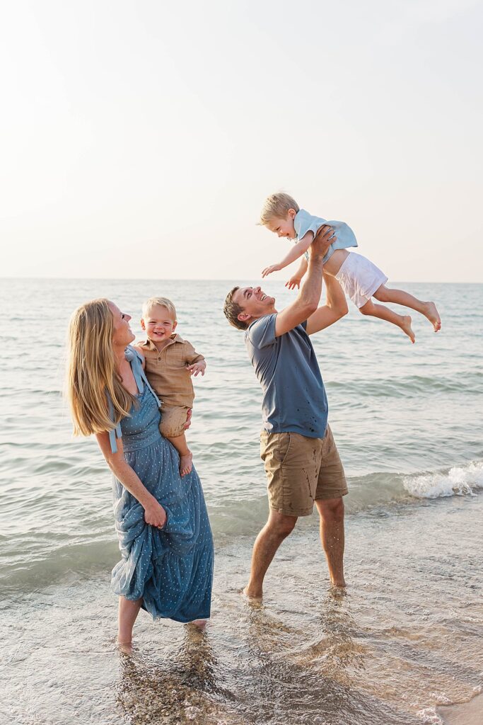 Candid family moments in the water at Empire Beach