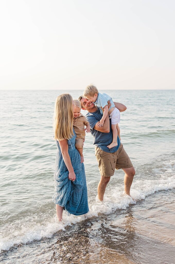 Family playing in the water at Empire Beach in Northern Michigan