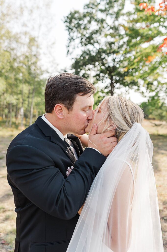 Couple portraits during a Northern Michigan fall wedding at Mill Pond Event Center