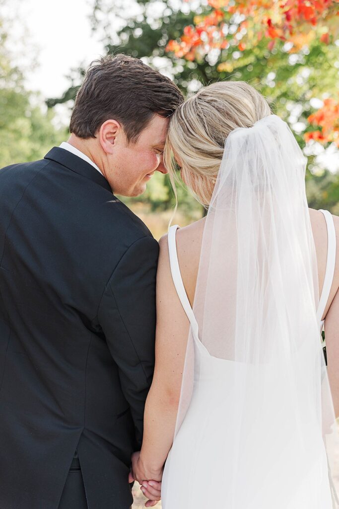 Documentary-style couple portraits from a Mill Pond Event Center fall wedding