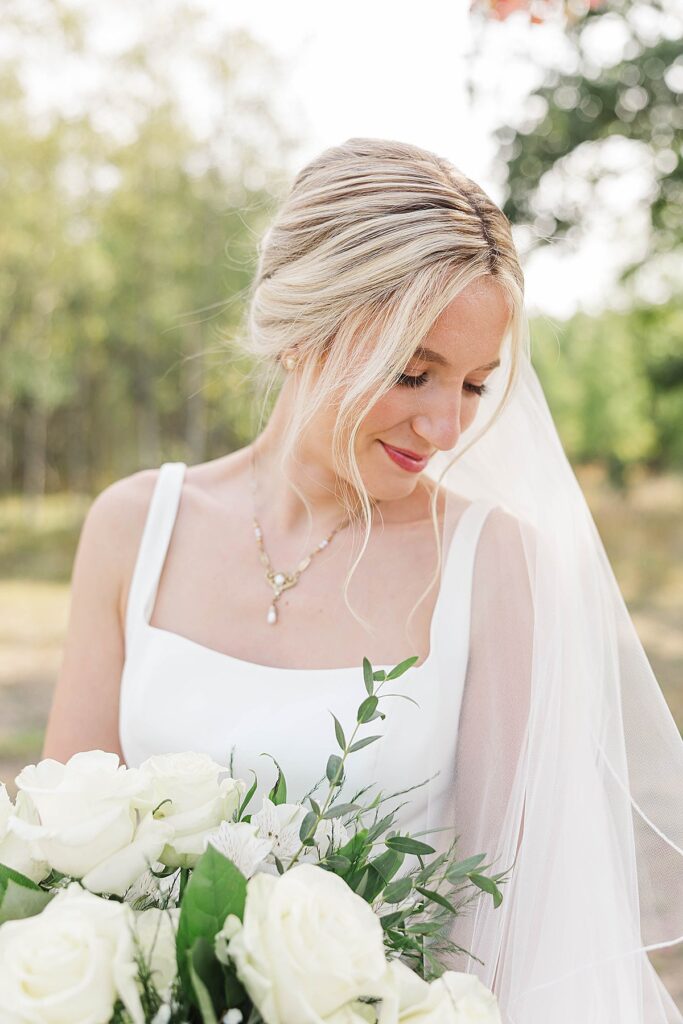 Bridal portrait with timeless fall florals at a Mill Pond Event Center wedding in Northern Michigan
