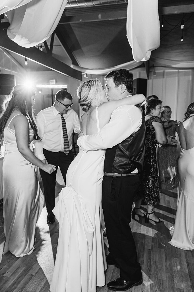 Black and white wedding reception moment at Mill Pond Event Center