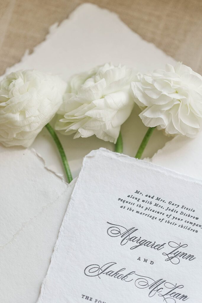 Fall wedding florals styled inside invitation envelope at Mill Pond Event Center