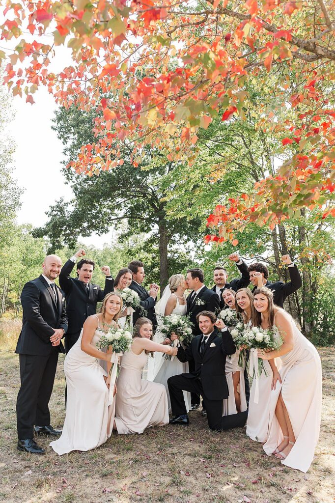 Bridal party cheering during wedding day portraits at Mill Pond Event Center