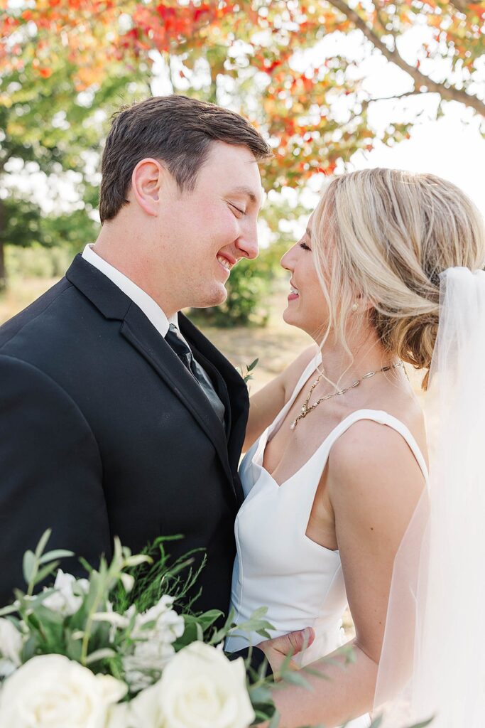 Documentary-style couple portraits from a Mill Pond Event Center fall wedding