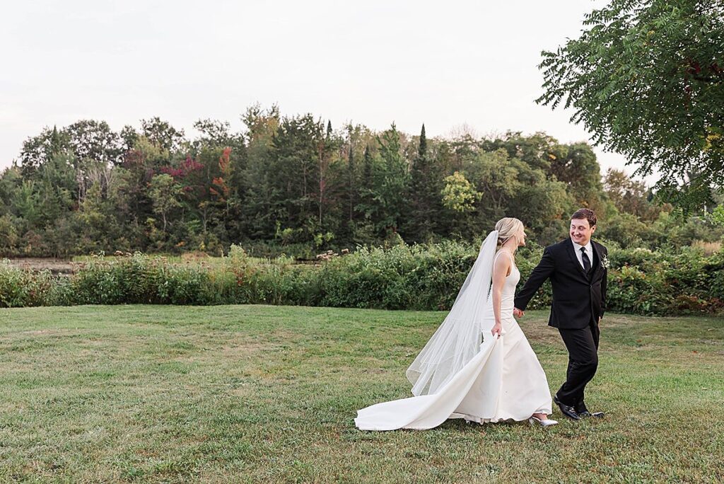 Bride and groom embracing during their wedding portraits