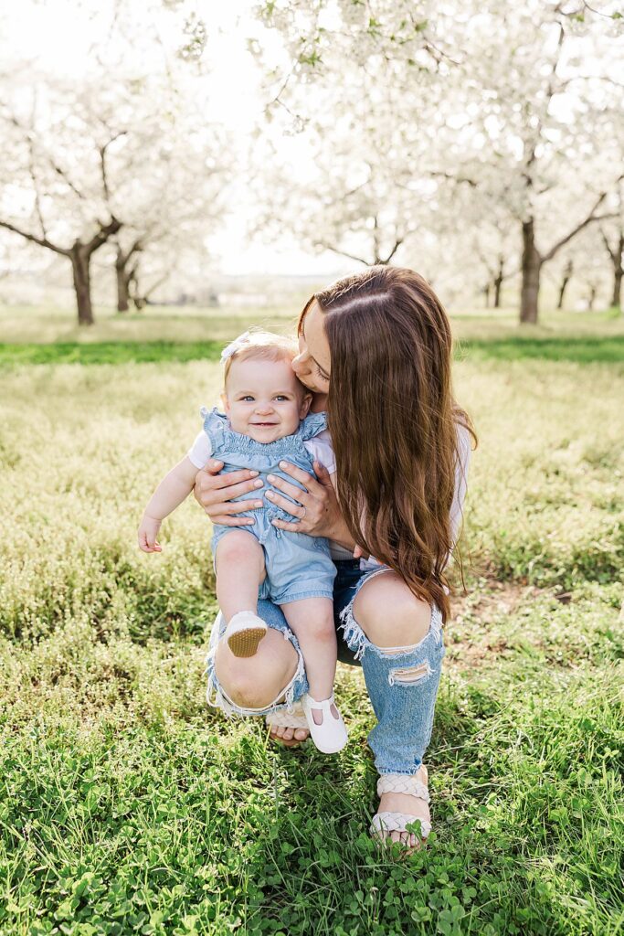 Family photography in a cherry blossom orchard