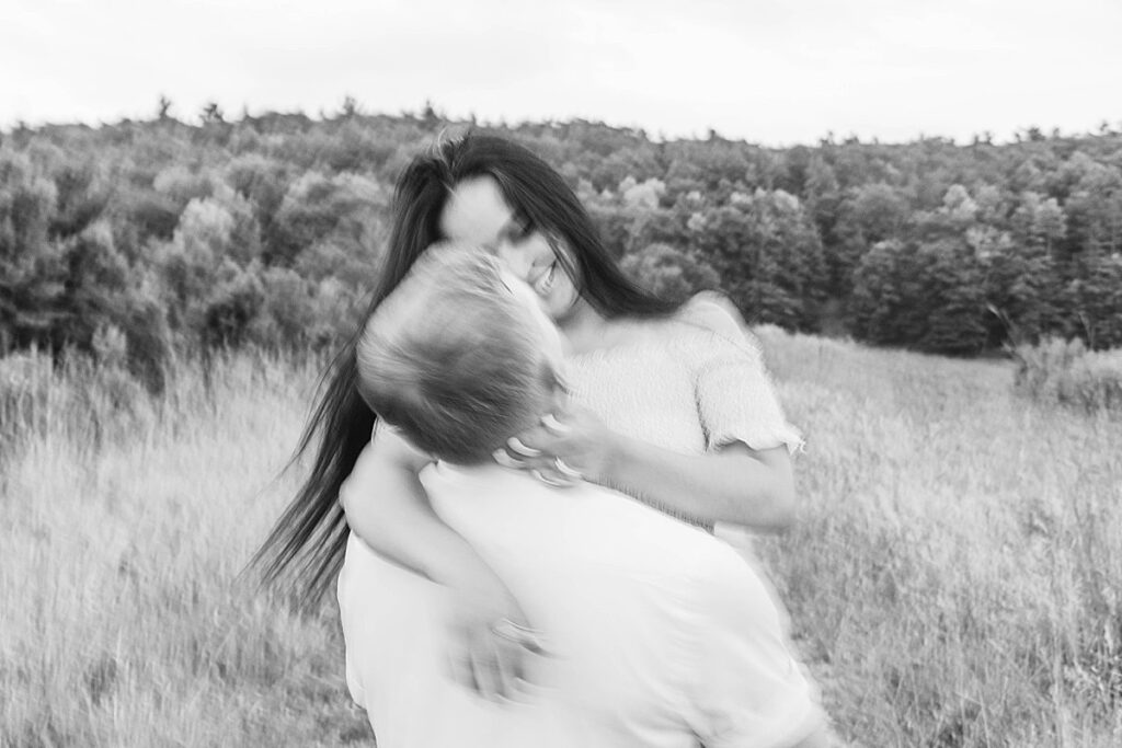 Intimate portrait of a couple embracing during a Northern Michigan engagement session.
