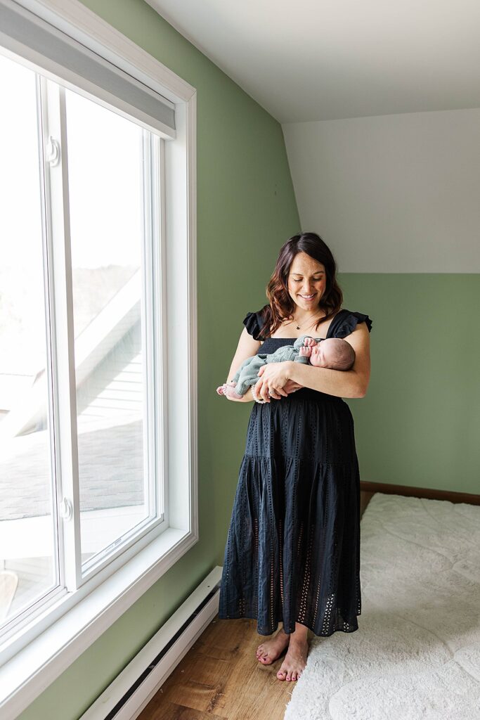 Emotional mother and newborn moment captured in Northern Michigan