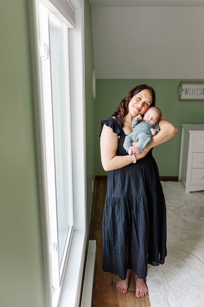 Mother holding her newborn during a Northern Michigan newborn session