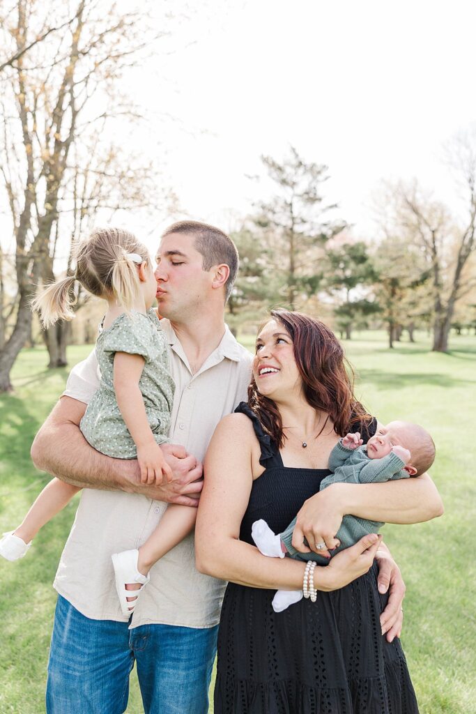 Outdoor newborn family photos taken during spring in Northern Michigan