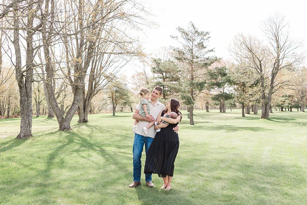 Lifestyle newborn session photographed outdoors on a spring day