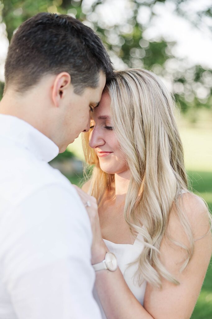 Michigan engagement session photographed on a private family property surrounded by trees