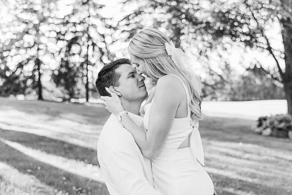 Romantic Michigan engagement photos captured in a tree-filled setting