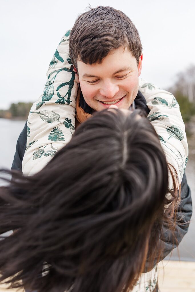 Couple sharing an emotional proposal moment along Boardman Lake Trail