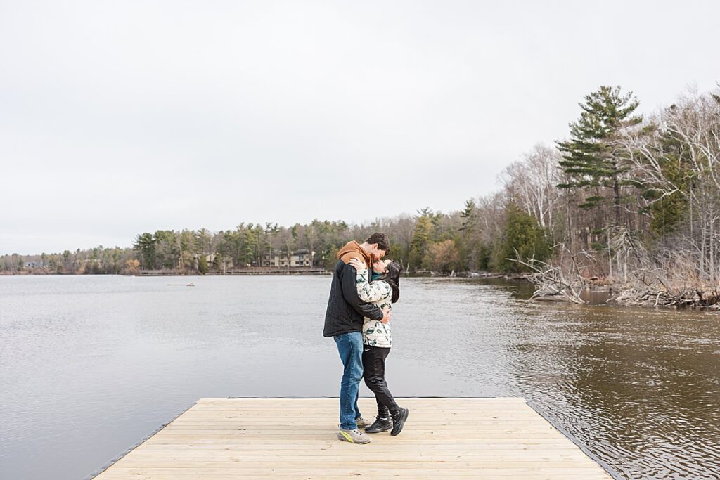 Couple embracing after a surprise proposal in Traverse City