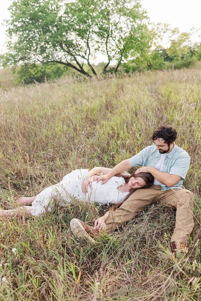 Romantic maternity photos of a couple in the Traverse City Botanical Gardens