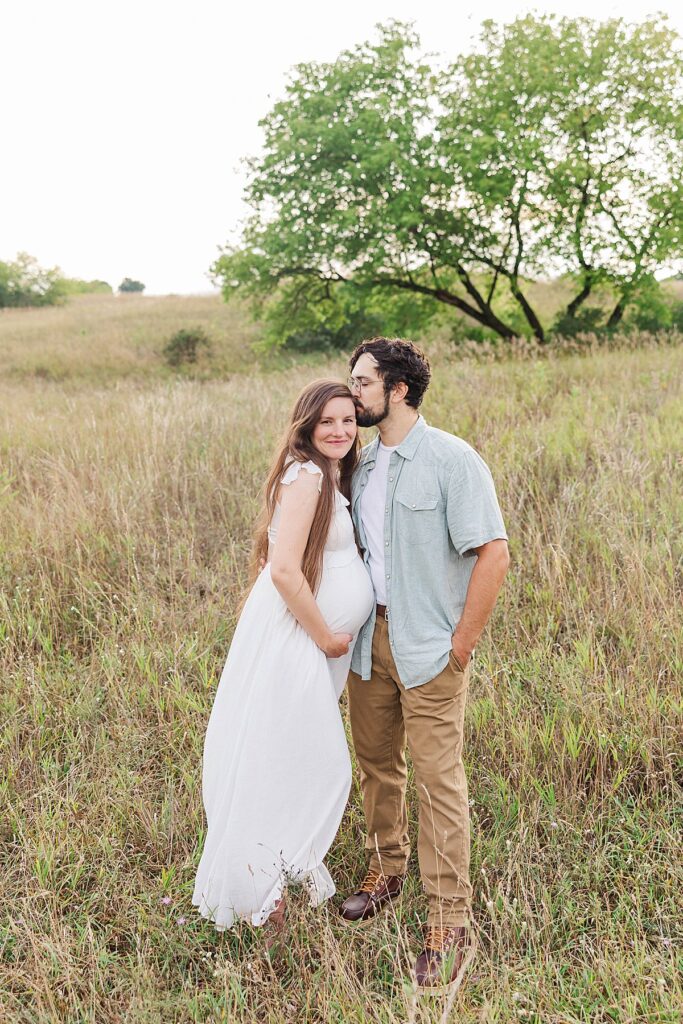 Intimate maternity photo of couple with baby bump in Northern Michigan