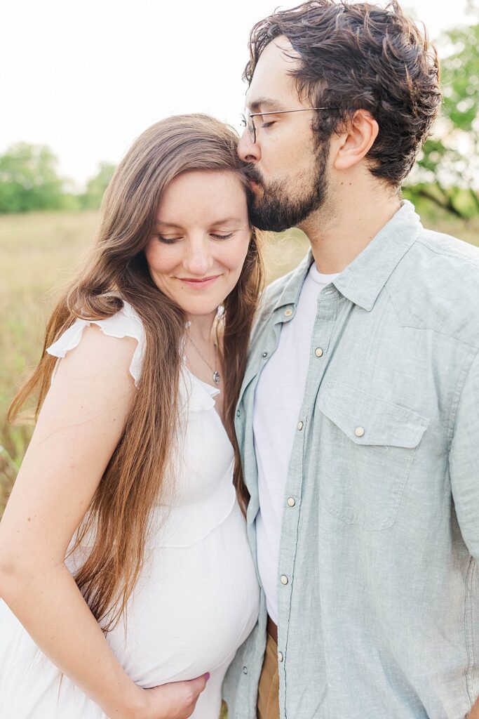 Expecting mom holding her baby bump during a Traverse City maternity session