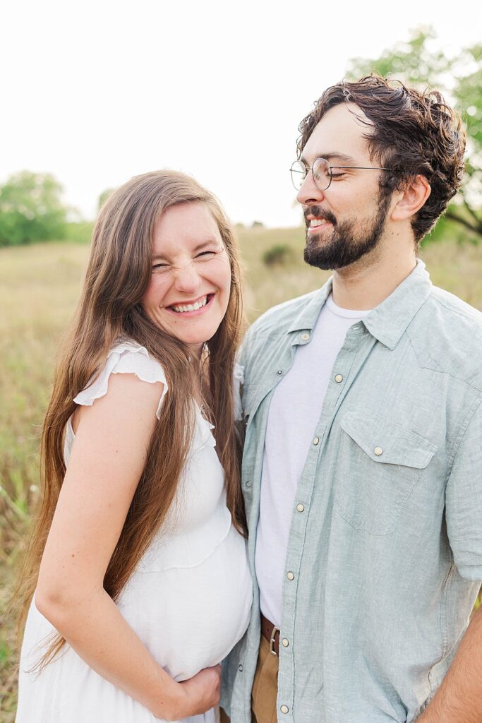 Sweet maternity portrait highlighting baby bump in a garden setting