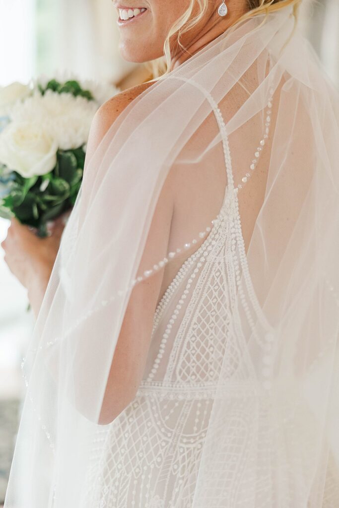 Bride with veil and floral details at Black Star Farms