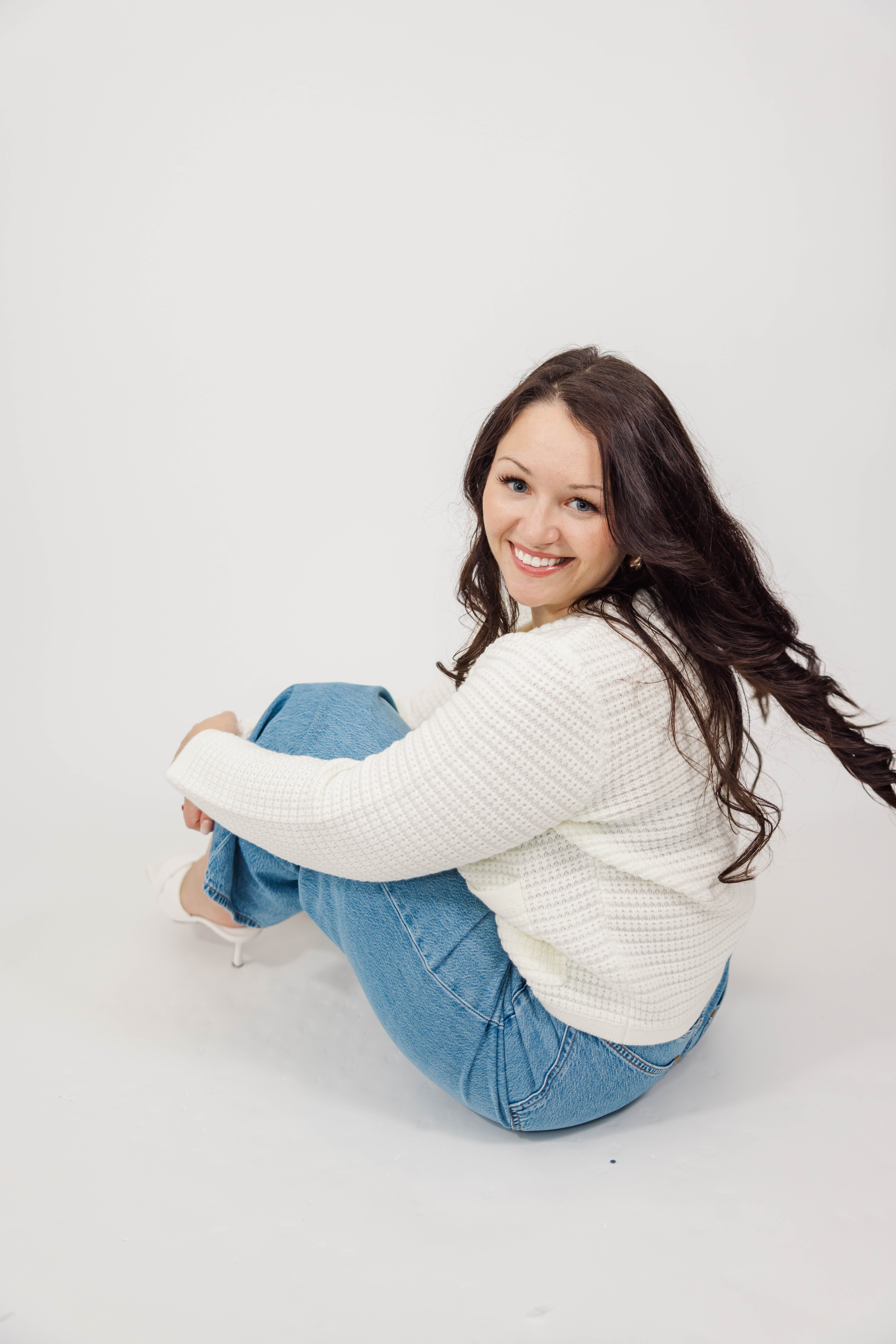 Photographer smiling in casual outfit — sharing advice and lessons learned from photographing weddings