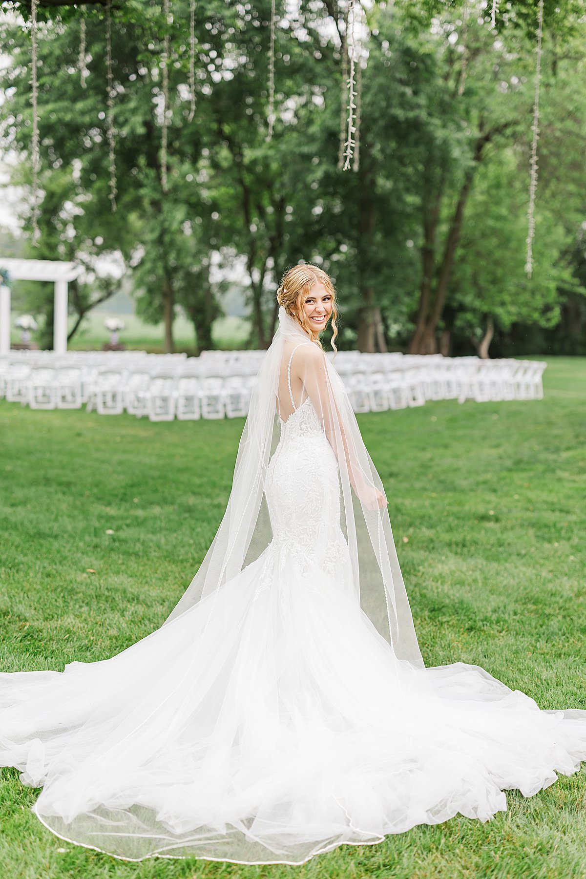 Bride wearing a flowing wedding gown during portraits at a Grand Rapids area wedding