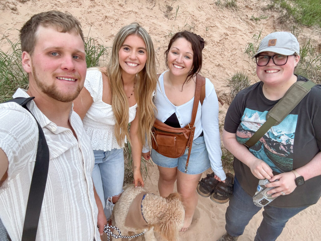 Behind-the-scenes selfie with the couple and their photography team during a Sleeping Bear Dunes engagement session