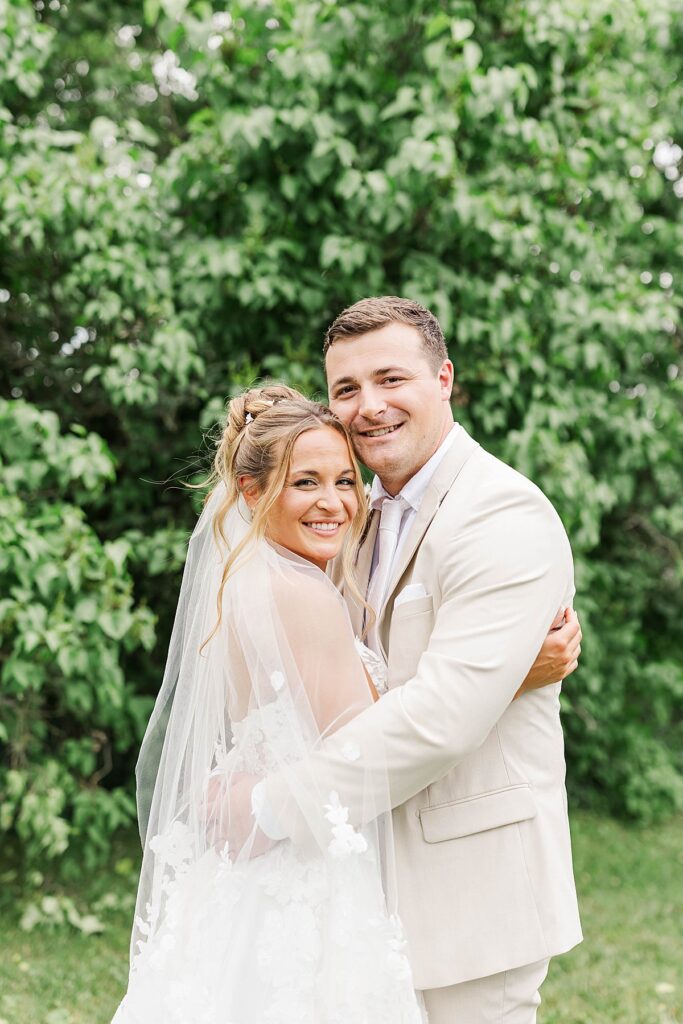 Bride and groom celebrating during their Blue Sky Barn wedding