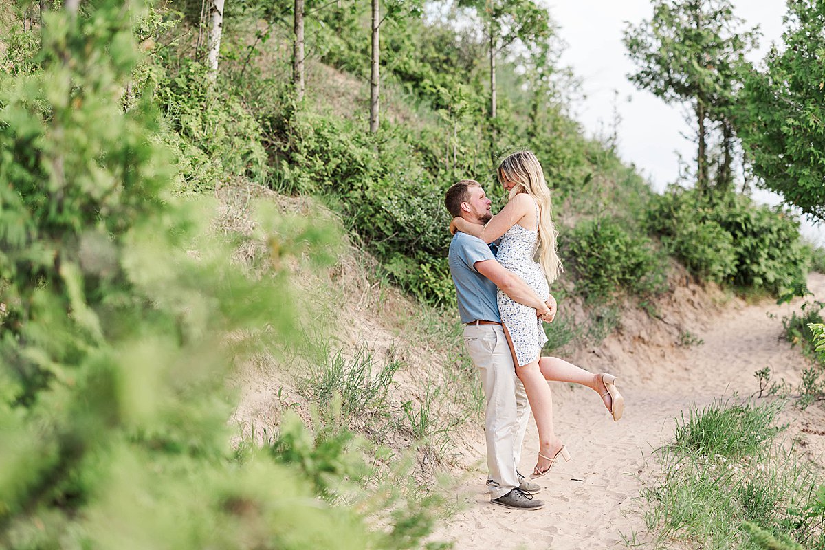 Candid couple portraits during a Sleeping Bear Dunes engagement session in Northern Michigan