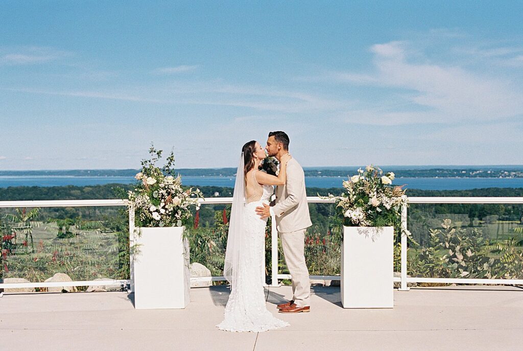 Romantic film portraits of a couple overlooking Grand Traverse Bay