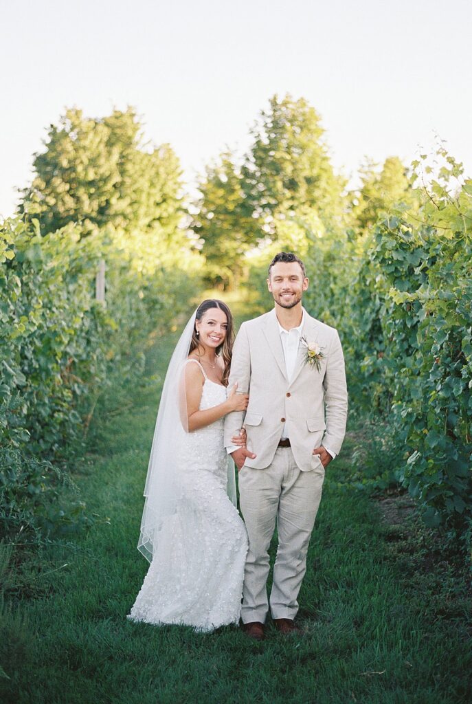 Romantic film portraits of a couple overlooking Grand Traverse Bay