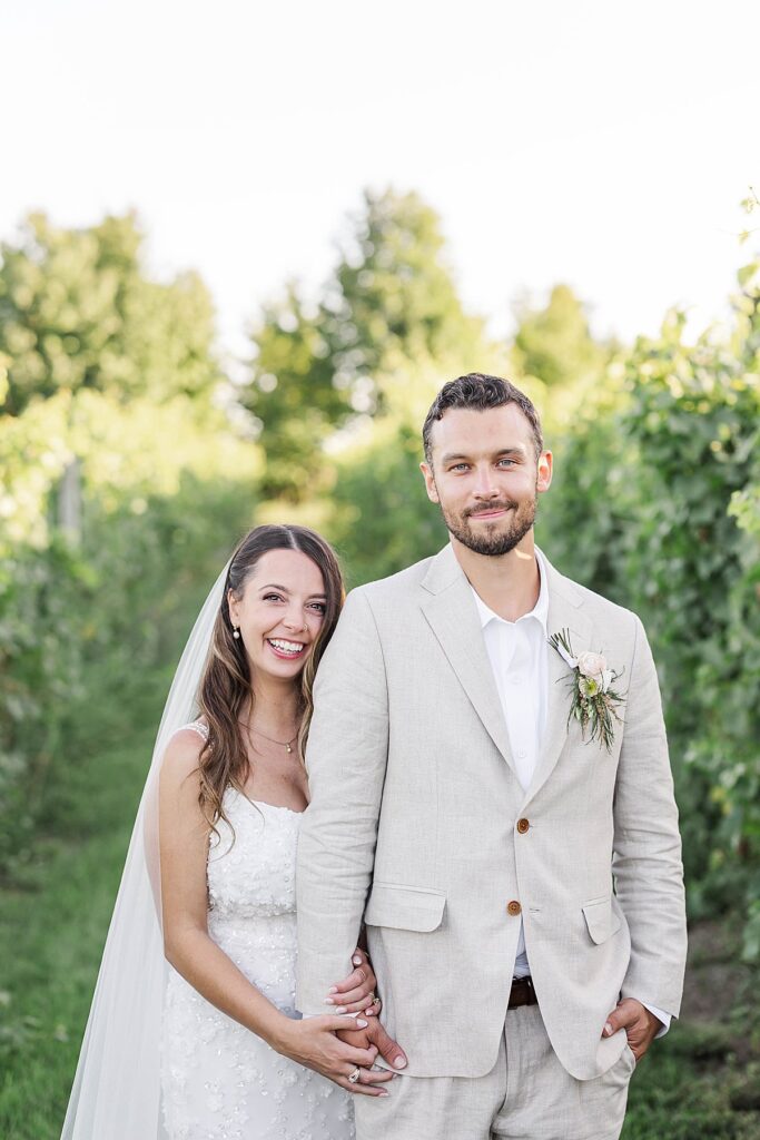 Bride and groom portraits in the vineyard at Bayview Weddings at Gallagher Farms