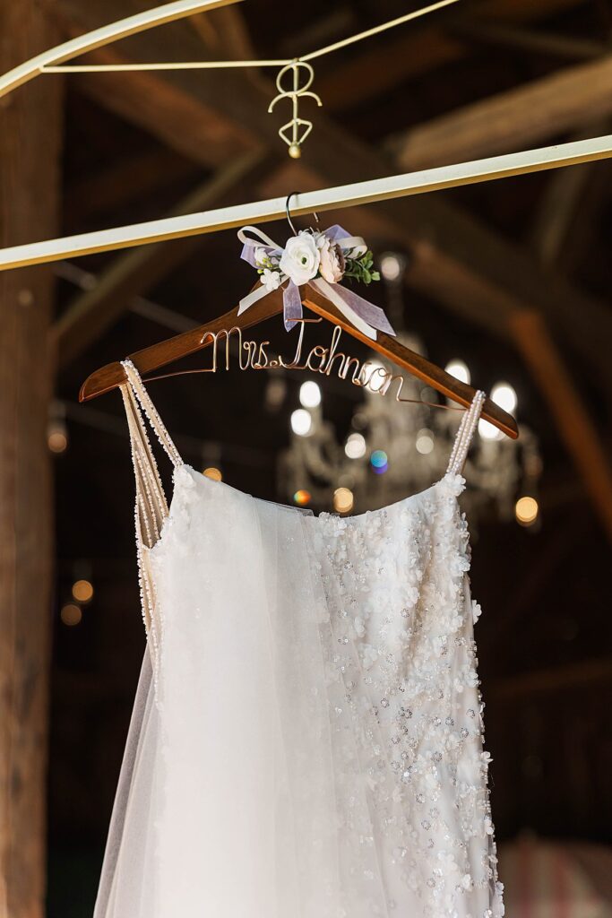 Bride’s wedding dress hanging at Gallagher Farms for a Bayview wedding in Northern Michigan