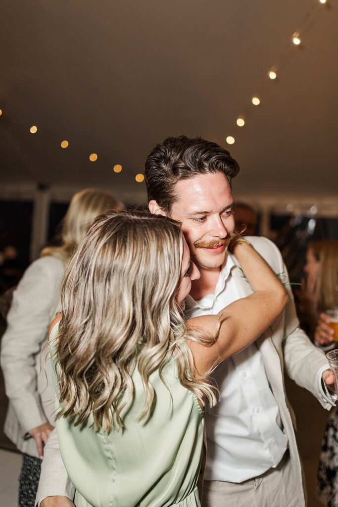 Couple dancing together during the Bayview wedding reception at Gallagher Farms