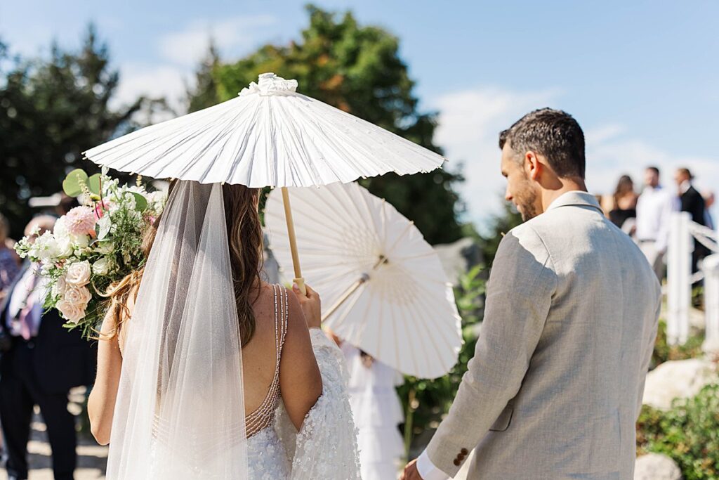 Candid moment between newlyweds at Bayview Weddings at Gallagher Farms