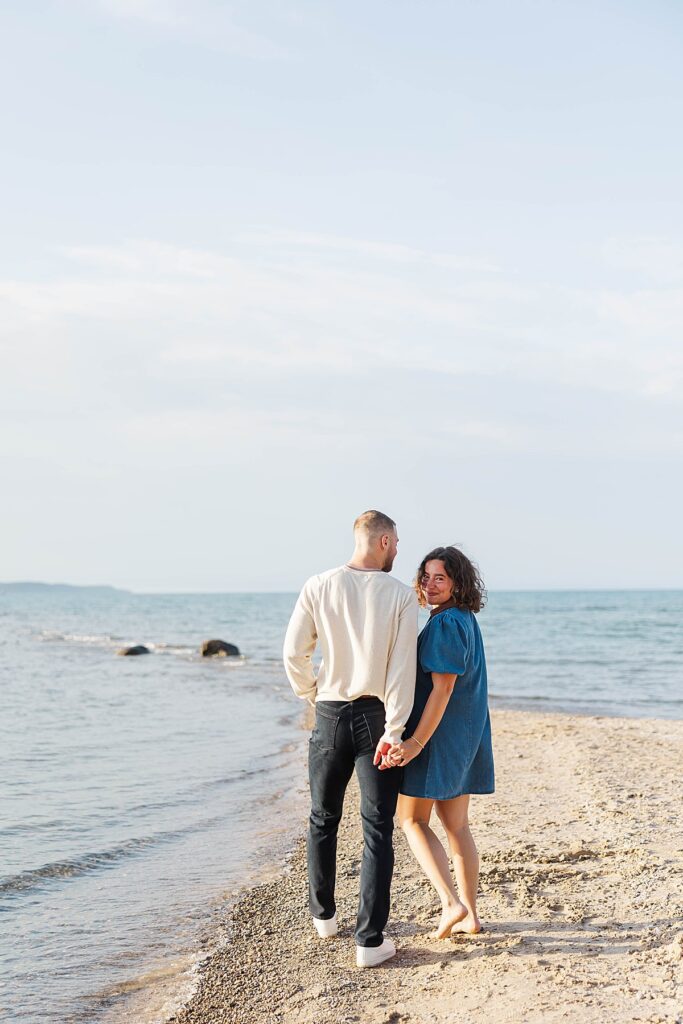 Couple sharing a quiet moment after their Elk Rapids proposal
