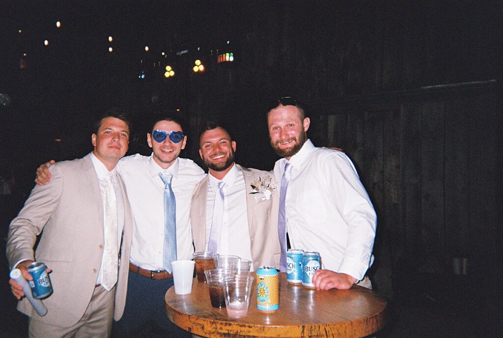 Candid reception moments captured on disposable camera at a Northern Michigan wedding